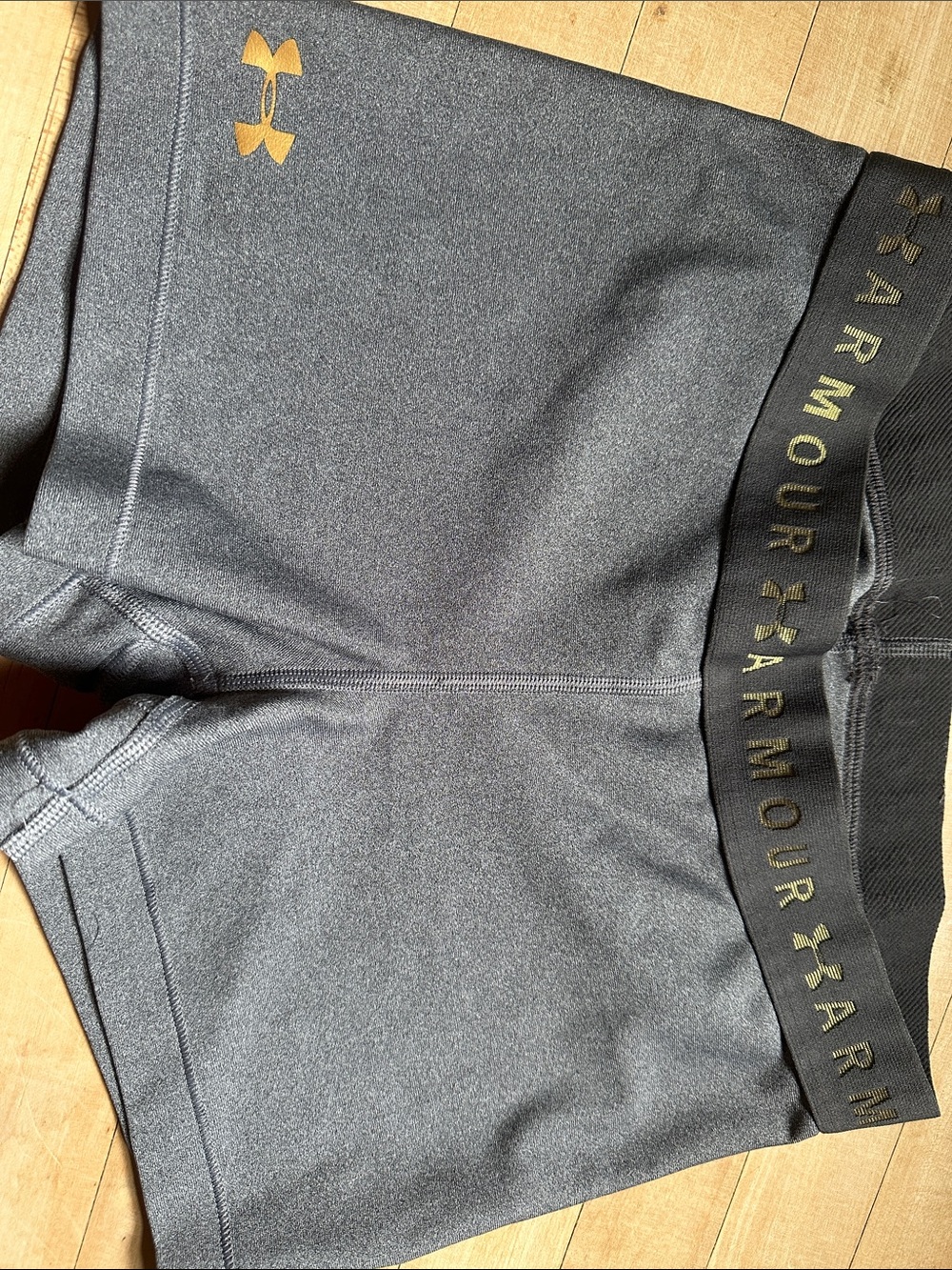Women’s Under Armour Charcoal Compression Shorts with Gold Accents